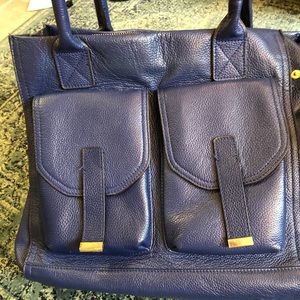 Unique hand bag with lots of pockets.